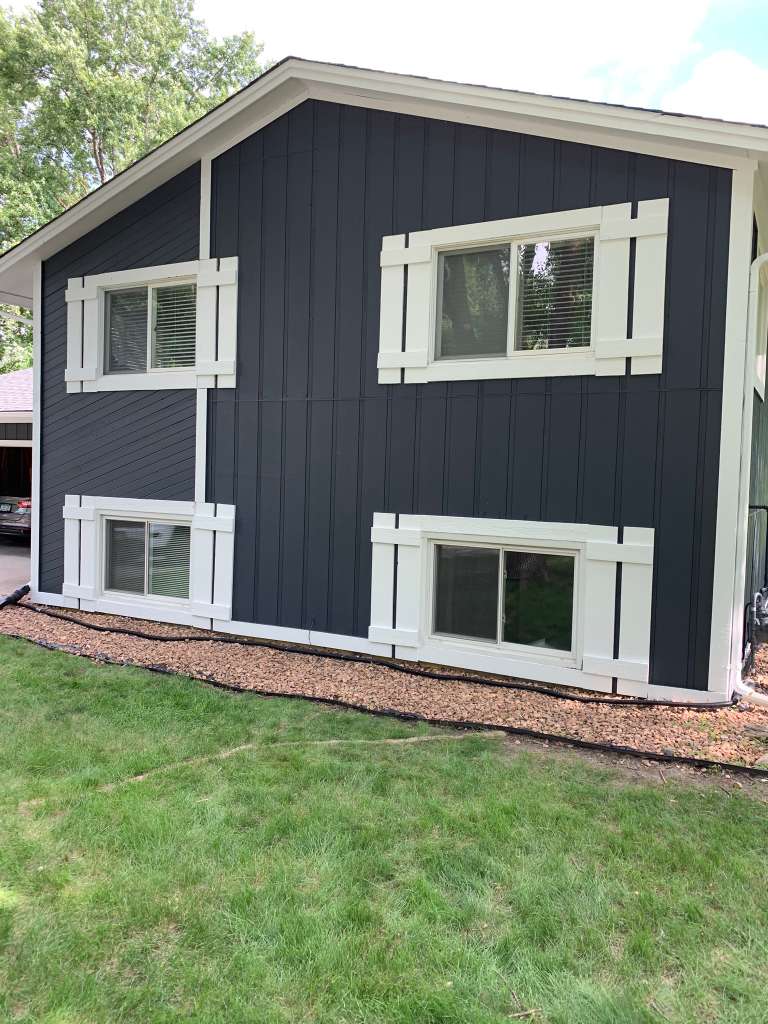House exterior after — modern navy blue