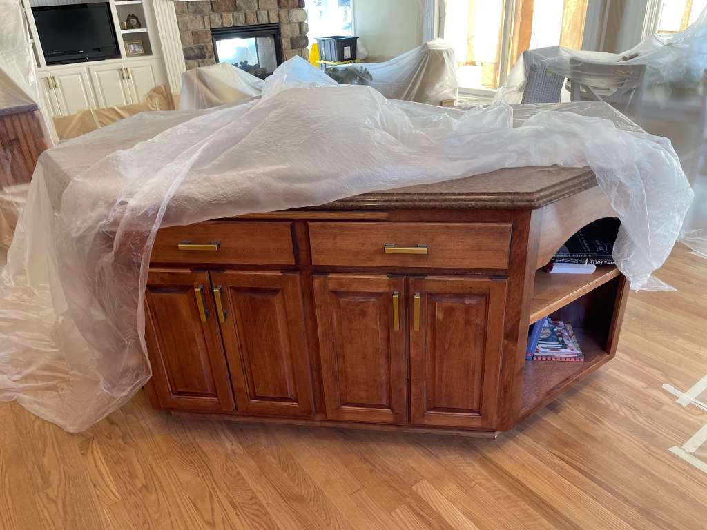 Living room before painting, protected with plastic